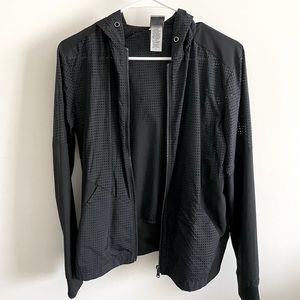 Breathable black running jacket with cutouts